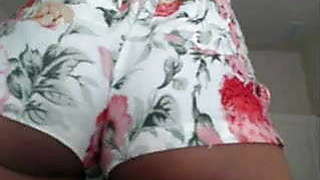 Mixed ebony chick shakes ass and shaven pussy